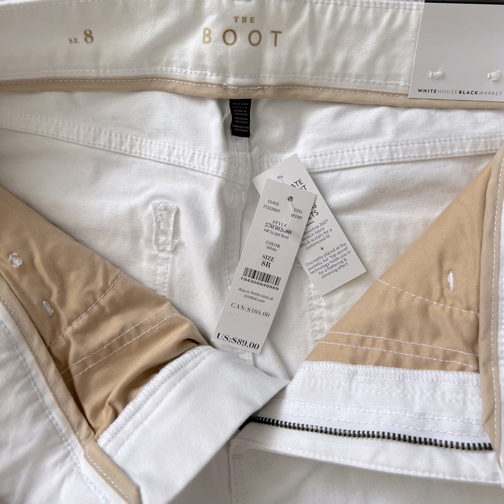 White House Black Market white boot cut jeans with stretch.